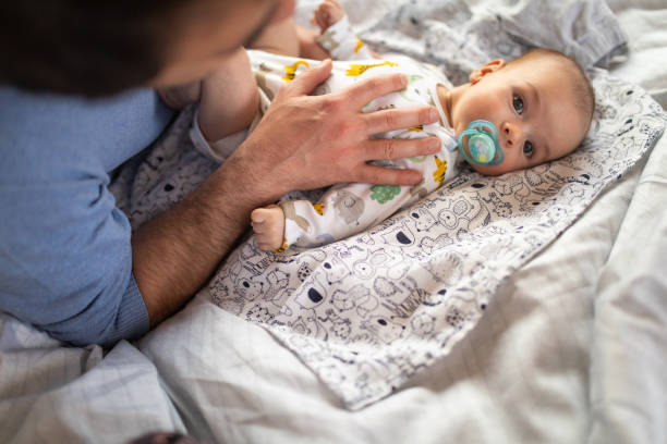 istock Unrecognizable dad taking care of son 1143730860