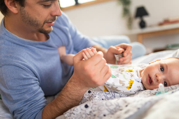 istock Happy dad playing with baby 1143730952