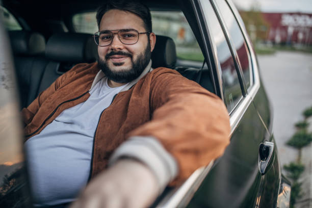 istock Man Into A Car 1143732230