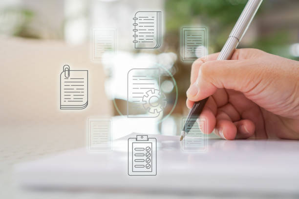 Document Report and business data system business HR technology Concept: Businessman Manager hands holding pen for checking and signing white documents reports papers of files icon in modern office