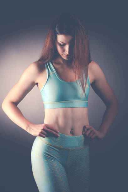 istock Active young fit woman with perfect body pose 1143734664
