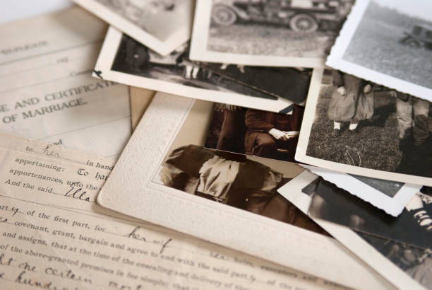 Old Genealogy Family History Photographs and Documents 1 Genealogy family history theme with old family photos and documents. nostalgia photos stock pictures, royalty-free photos & images