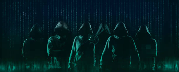 dark web hooded hacker stock photo