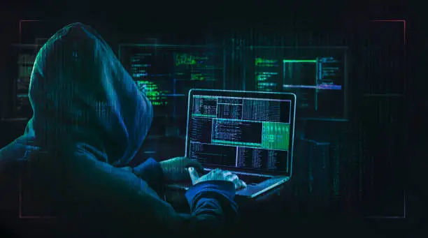 Photo of dark web hooded hacker