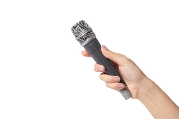 Wireless microphone in hand isolated on white Wireless microphone in hand isolated on white web radio stock pictures, royalty-free photos & images