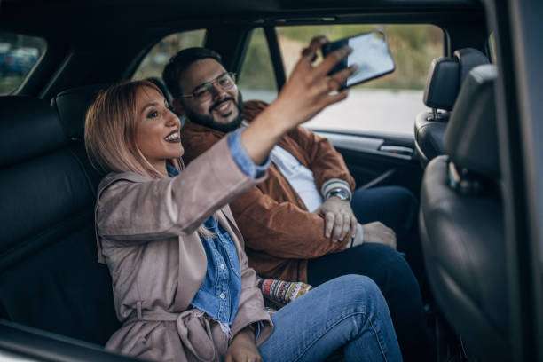 istock Friends in the car making selfie 1143737688