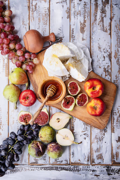 istock Home made ricotta cheese served with fresh fruits 1143740203