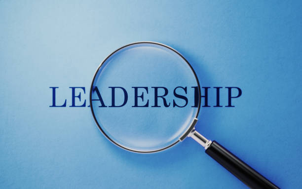 istock Magnifier And Leadership Text On Blue Background 1143747986
