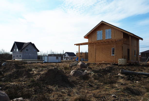 Construction of a cottage village. Construction of modern housing for different people. Details and close-up.
