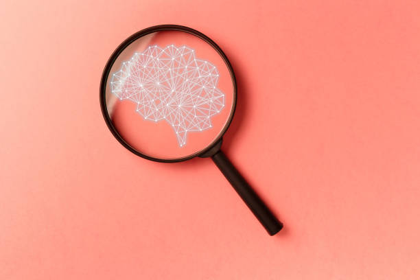istock Concept smart search. Searching information data on internet networking concept. AI(Artificial Intelligence) and Neural network. Magnifying glass on coral background. Living Coral color 1143751620