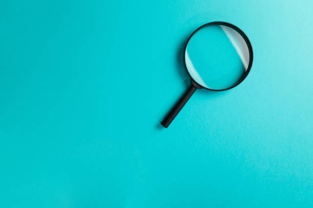istock Magnifying glass on blue background. Top view. Flat lay. Copy space. Minimal creative concept. Search concept 1143753373