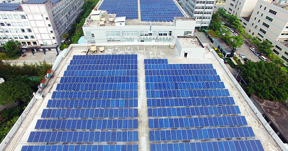 aerial view of professional drone, of Solar Panels At Roof Of Apartments