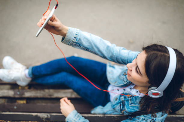 istock Making selfies and listening to music 1143759898