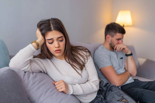 istock Unhappy couple having argument at home 1143759932