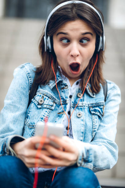istock Using phone and listening to music 1143760114
