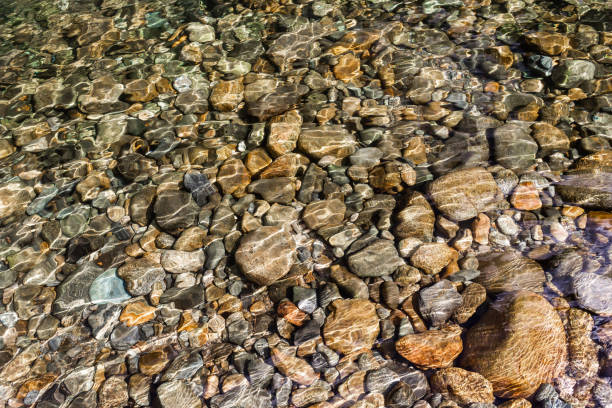 Stones in mountain river under water