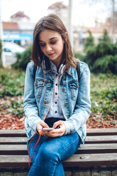 istock Using phone and listening to music 1143760688
