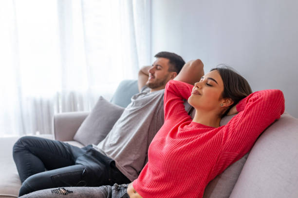istock Couple at home relaxing in sofa. 1143762389