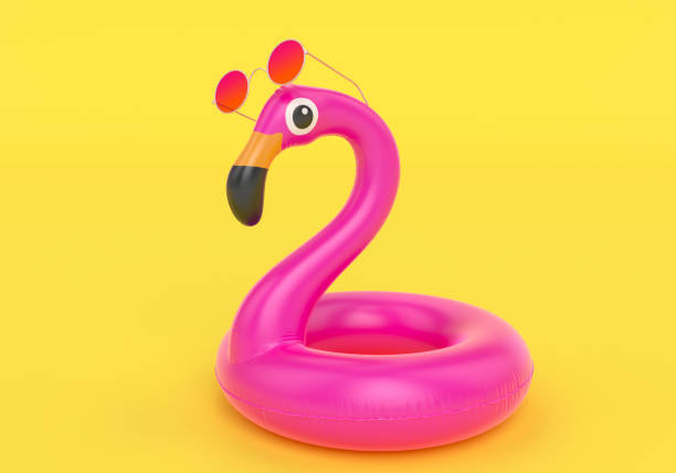 istock Inflatable flamingo in sunglasses isolated on yellow background, 3d rendering 1143763406