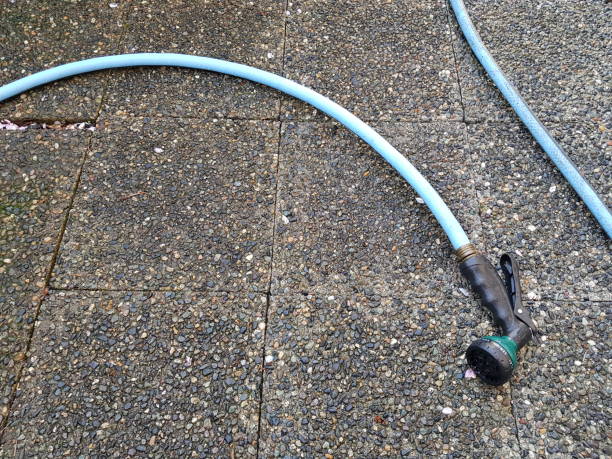 istock Blue hose on the wet ground 1143764559