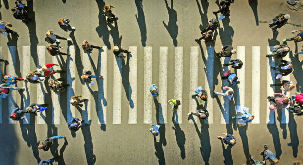 istock Pedestrian crowd crossing crosswalk. Top view. 1143767443