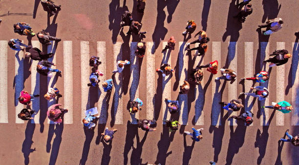 istock Pedestrian crowd crossing crosswalk. Top view. 1143767477