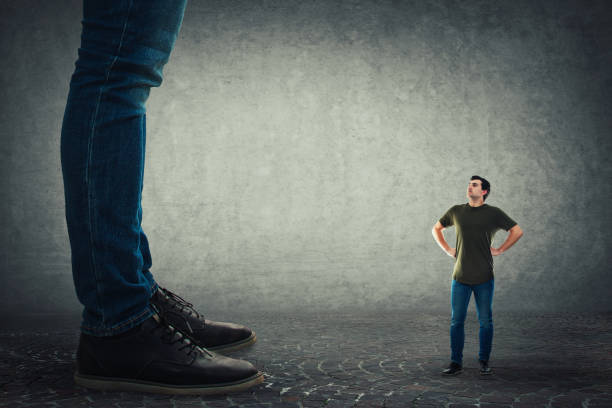 istock tiny employee ready to fight his big boss 1143771425