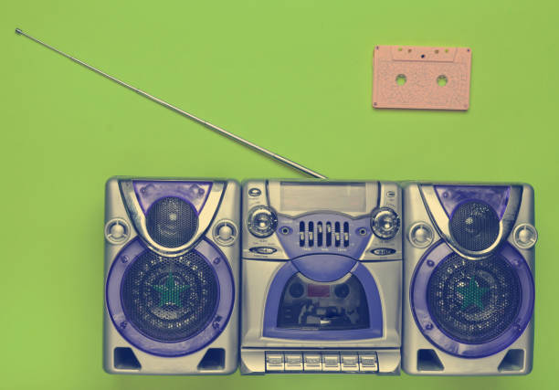 Close-up of a vintage radio tuner displaying FM and AM frequencies with illuminated dials and indicators.