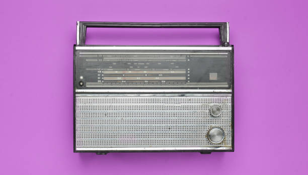 istock Obsolete retro radio receiver on a pink pastel background. Top view. 1143777447