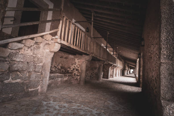 The covered medieval cloisters within the main square at Lluc, Sierra de Tramuntana, Mallorca, Spain.  Lluc (Santuari de Lluc) is a former monastic site and has been a site of pilgrimage since the late 13th century.