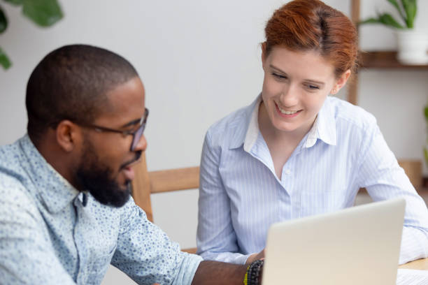 istock Diverse colleagues working on online project together, using laptop 1143790758