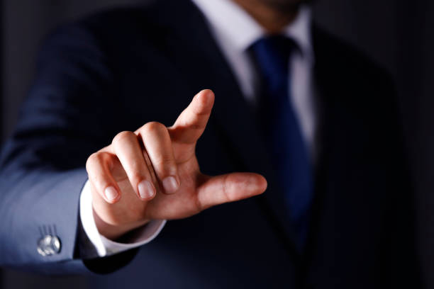 istock Business man touching imaginery screen 1143792574