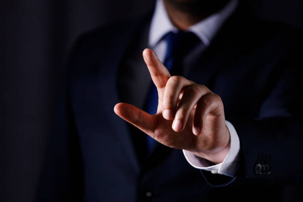 istock Business man touching imaginery screen 1143792632