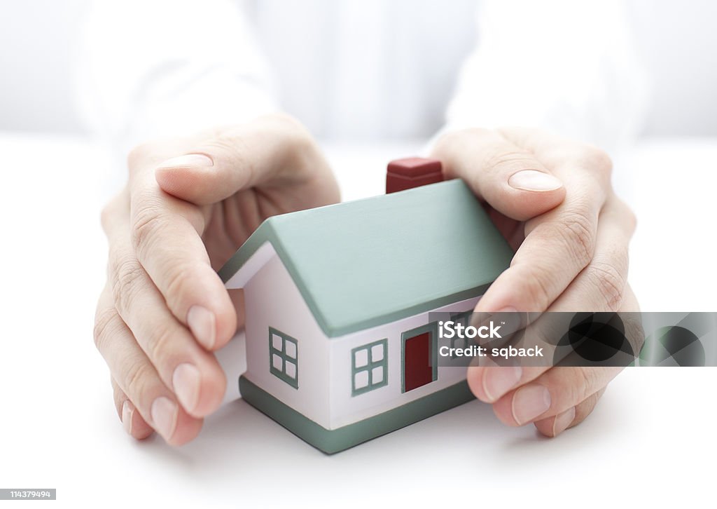 Schützen Sie Ihr Haus - Lizenzfrei Wohngebäudeversicherung Stock-Foto