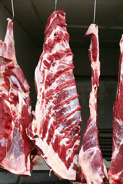istock red beef meat hanging at butchers 114379572