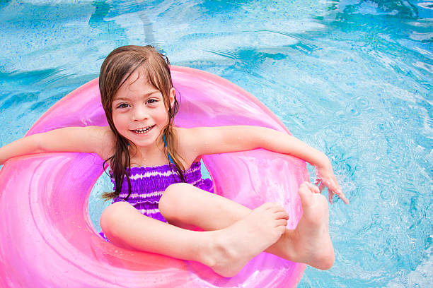 istock Child Happily playing in the swimming pool 114380351