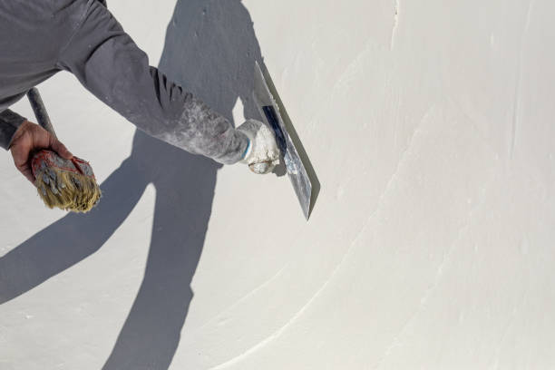 istock Worker Smoothing Wet Pool Plaster With Trowel 1143806912