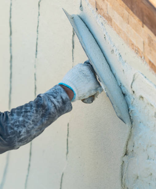 istock Worker Smoothing Wet Pool Plaster With Trowel 1143806989
