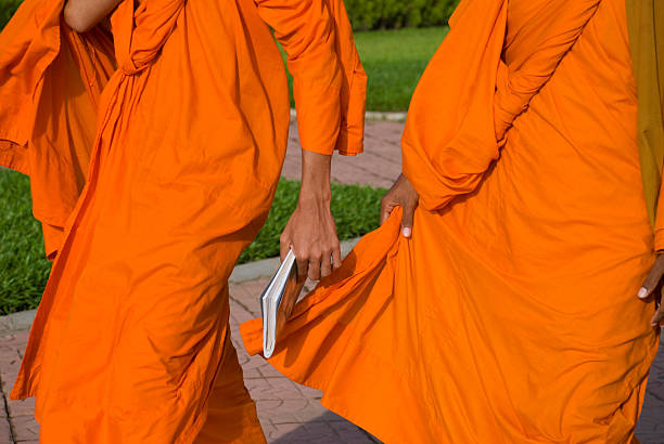 istock Buddhist monk carrying a book in Cambodia 114381688