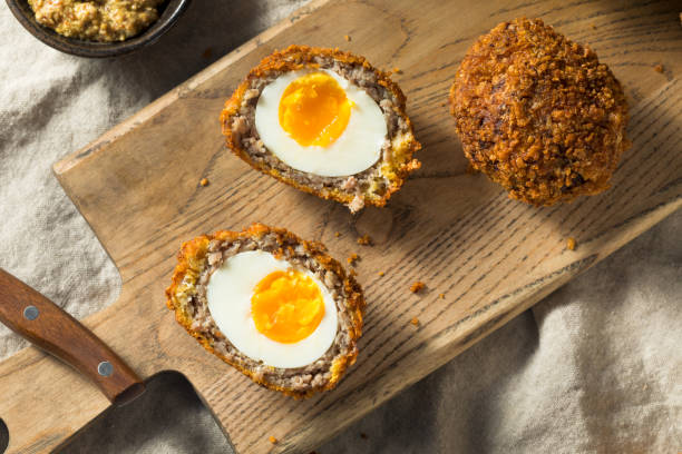 Homemade English Scotch Eggs Homemade English Scotch Eggs Wrapped in Sausage breaded photos stock pictures, royalty-free photos & images