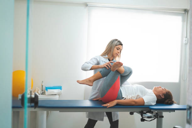 istock Doctor doublingbending her patient's leg 1143819769