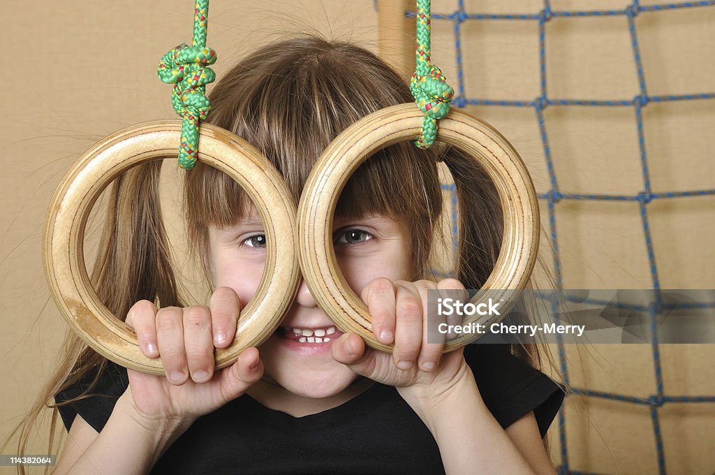 child with gymnastic rings  6-7 Years Stock Photo
