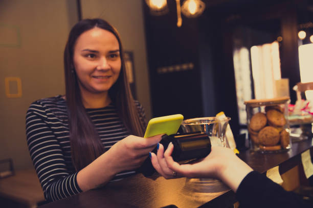 istock Customer paying by phone at a store 1143824951
