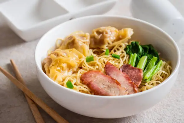 Photo of Egg noodle with wonton and red roasted pork, Asian food style