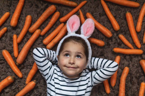 istock Serene smiling child with bunny ears during Easter 1143827221