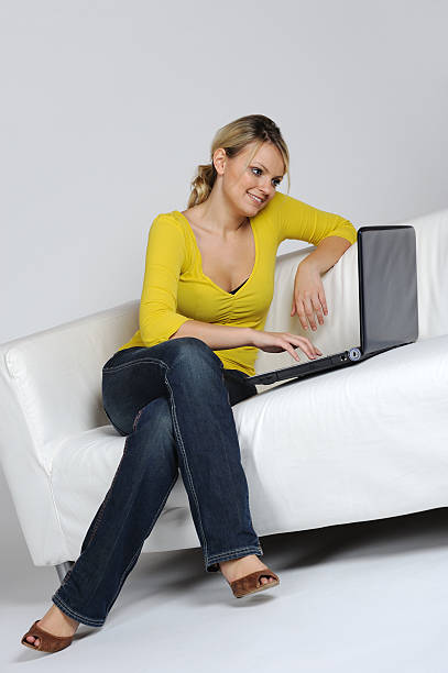 istock Young blond Woman Chill with Notebook on Sofa 114382833