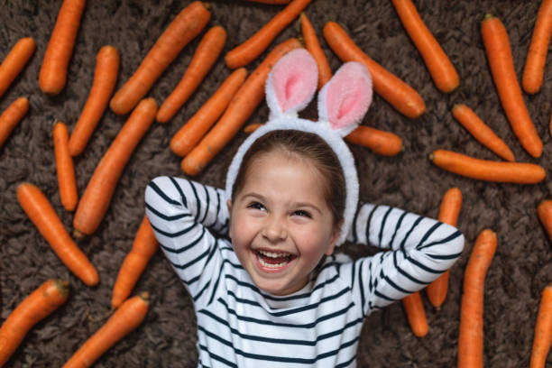 istock Gorgeous little child with bunny ears during Easter 1143828432
