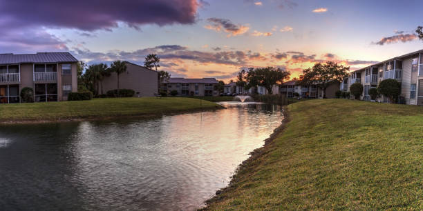 istock Bench overlooking a large pond with a fountain 1143830538