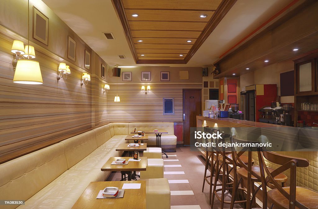 Cafe Interior Cafe interior with wooden furniture, lighting equipment and decoration. Architecture Stock Photo