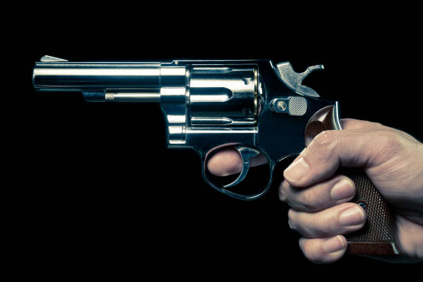 istock Vintage Stainless Gun or Shooter in Human Hand Side View 1143837291